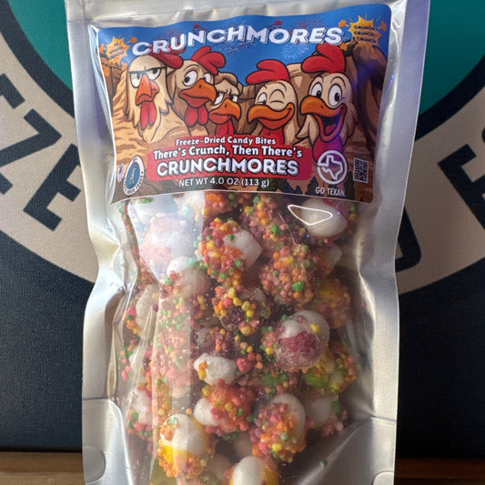 Packaged Crunchmores candy bites with colorful coating on a branded background